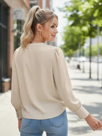 Woman wearing a beige blouse a Chiffon V-Neck Button-Down Shirt - Long Sleeve Business Casual Blouse