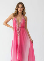 Side profile of the V neck high low dress hemline on a summer evening