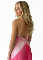 Back view of the Flamingo halter maxi dress showing the open back detail