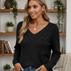 Close-up of the chevron pointelle pattern. Detailed chevron pointelle texture on a casual cardigan.