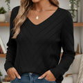 Front view of the black V-neck sweater in natural light. Model wearing black lightweight cardigan sweaters with V-neck design