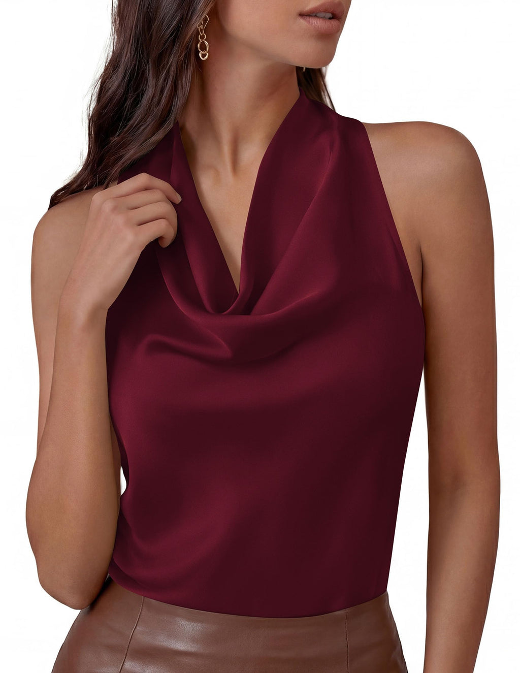 Woman wearing a pink halter crop top with white trousers for a vacation look